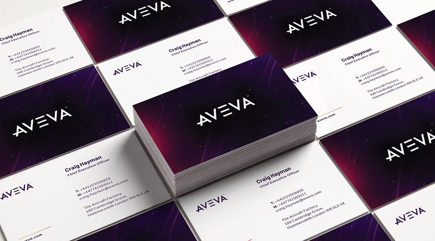 AVEVA post-merger brand identity design shown on business cards